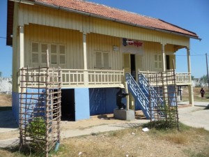 The freshly painted school with new classrooms and fruit trees